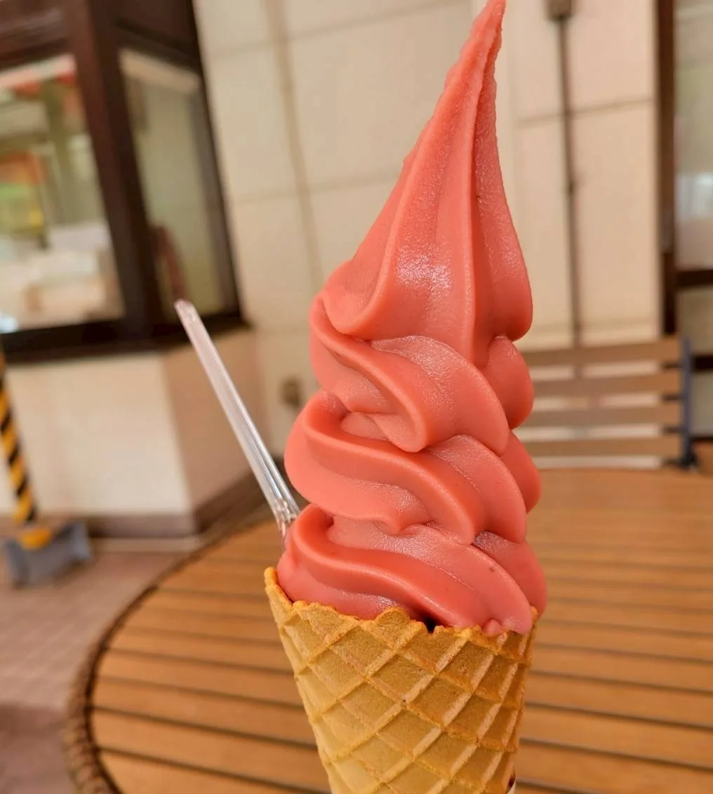 Strawberry-flavored soft-serve ice cream on a hot summer day