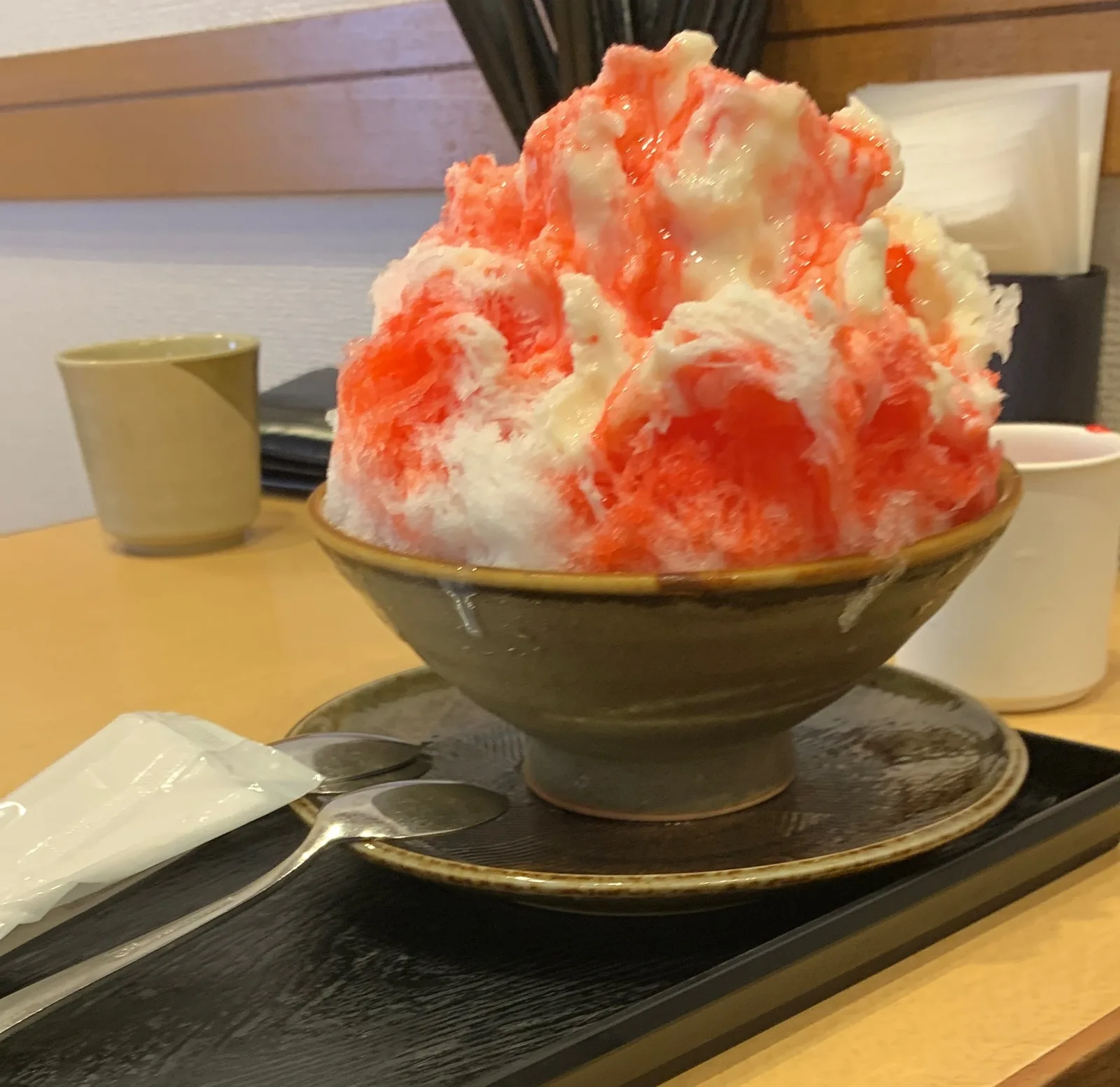 Strawberry kakigori topped with plenty of milk
